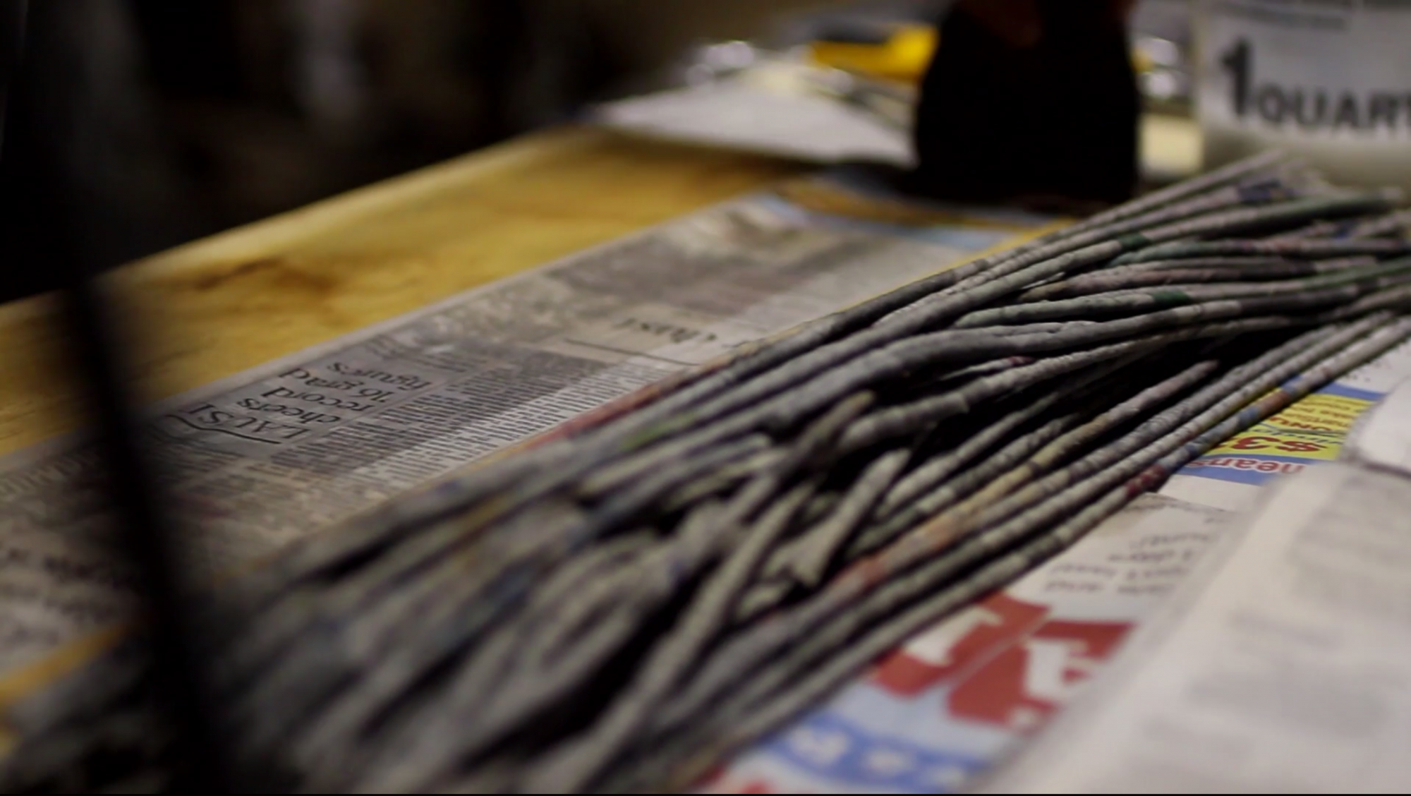 Three strips of newspaper